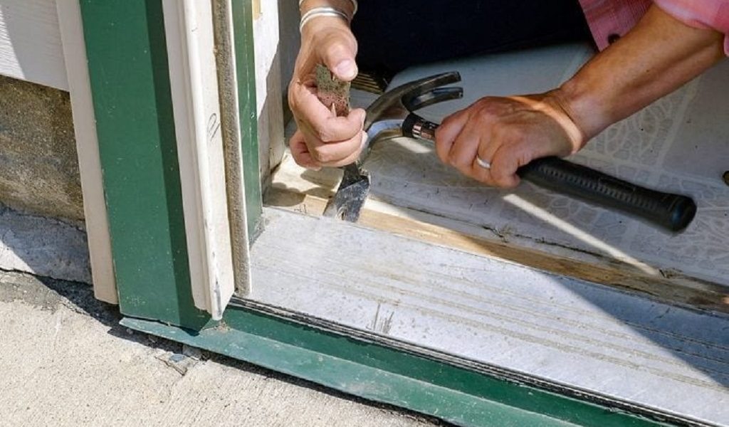 How long should I wait before hanging the door after frame installation