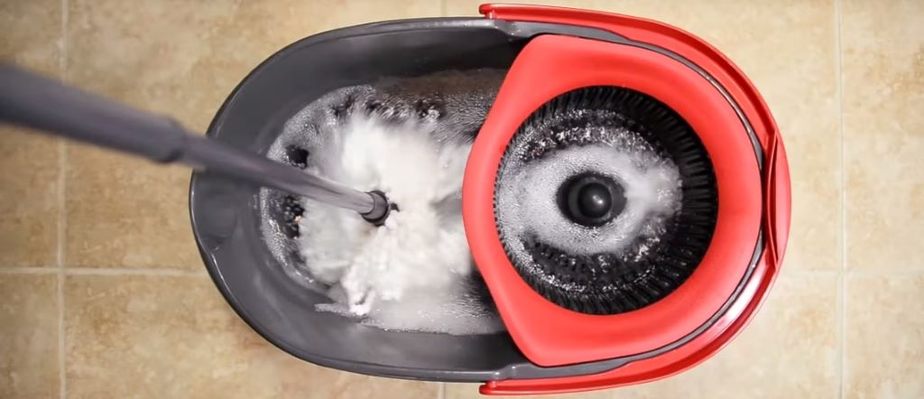 Close-up view of O Cedar mop bucket pedal system showing internal components