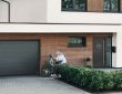 Modern garage door designs 2025 in the UK featuring sleek wood and smart automation