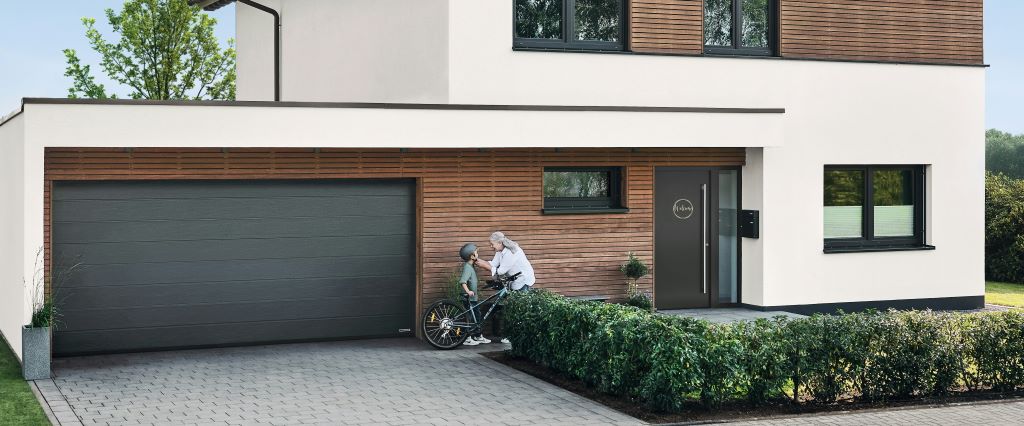 Modern garage door designs 2025 in the UK featuring sleek wood and smart automation