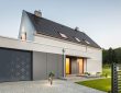 Modern UK garage door with bold colors and sleek metallic finishes enhancing home exterior design