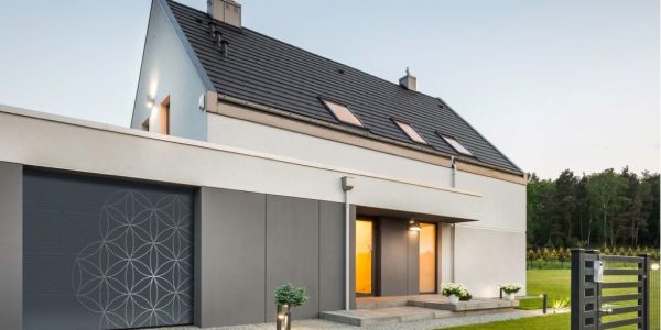 Modern UK garage door with bold colors and sleek metallic finishes enhancing home exterior design