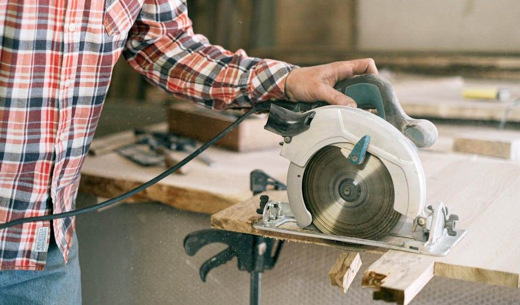 Close-up of a 5 1 2 inch circular saw mid-cut on plywood, showcasing clean edges and compact design for home DIY.