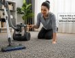 Vacuum cleaning thick pile carpet with adjustable height setting