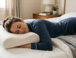A side sleeper resting comfortably on a white latex pillow with proper neck and spinal alignment