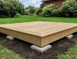 Backyard platform sinking into clay soil in Denver residential yard