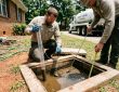 Huntsville, AL septic pros measure sludge with a Sludge Judge (clear pipe) and scum using a stick with a hinged flap. Get precise tank levels.